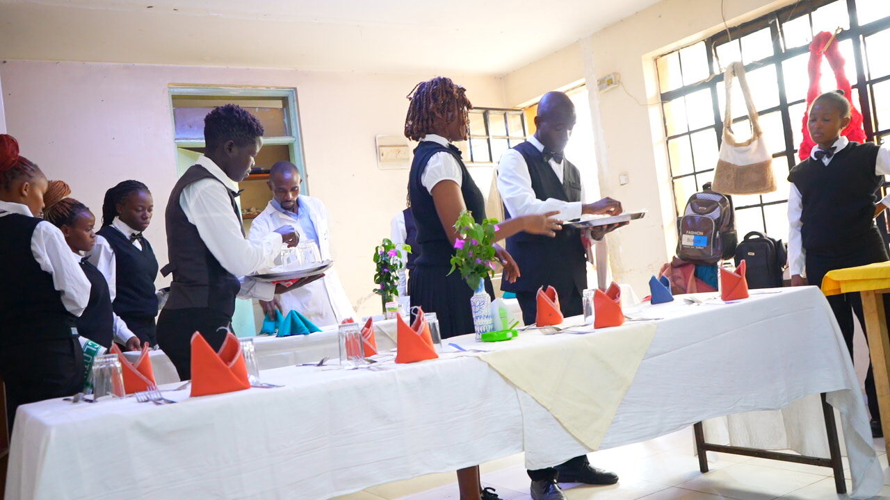 Topmax students learning hospitality through practical training